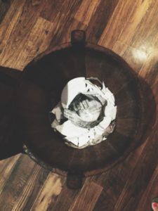 Wooden bucket with the broken plate