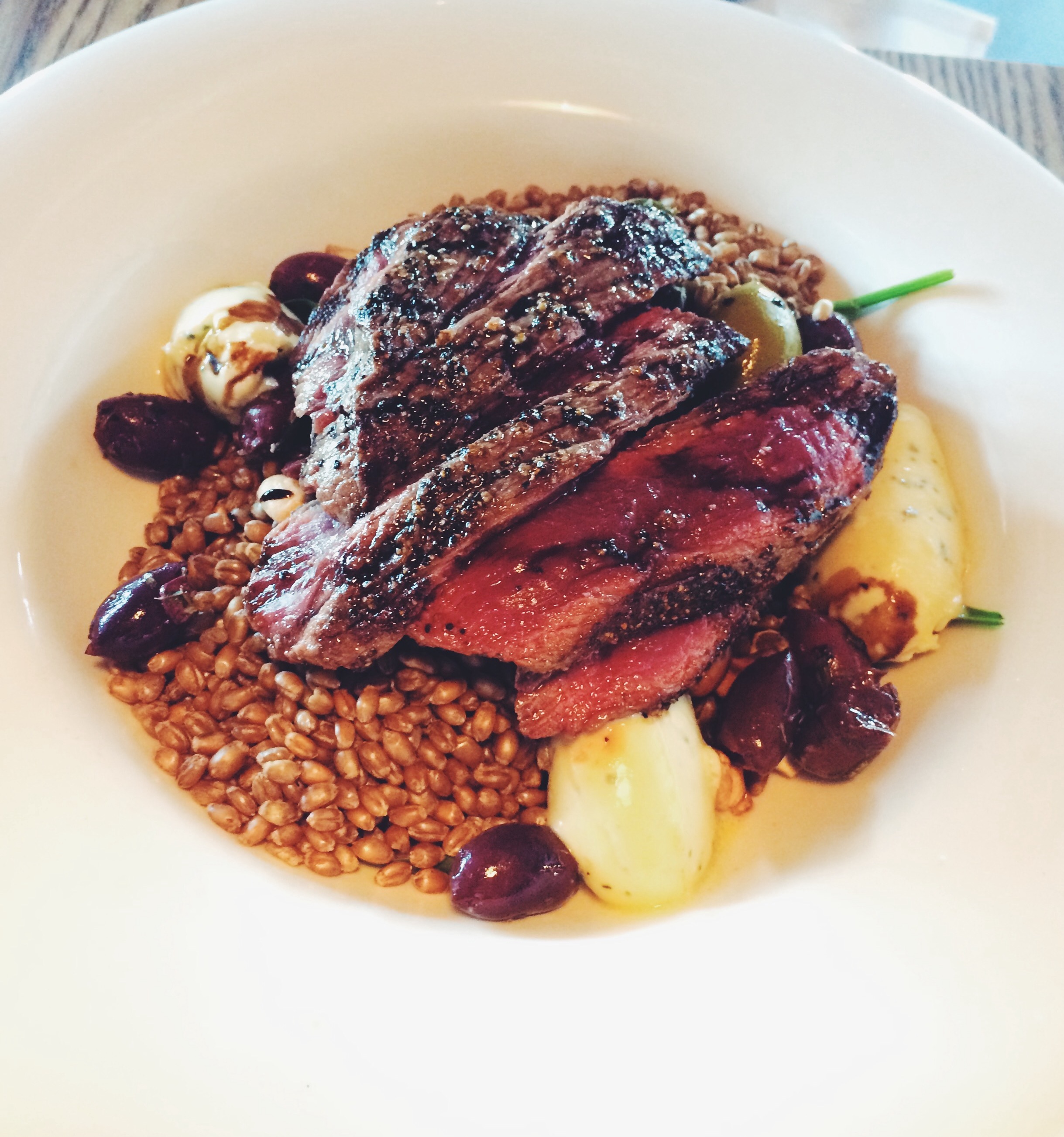 Seared venison, baby spinach, toasted cashews, marinated olives, freekeh, blue cheese dressing, balsamic reduction $35